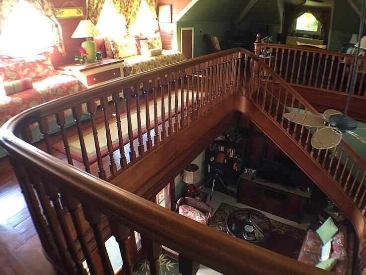 Curved mahogany staircase railing by Stephan Scholz